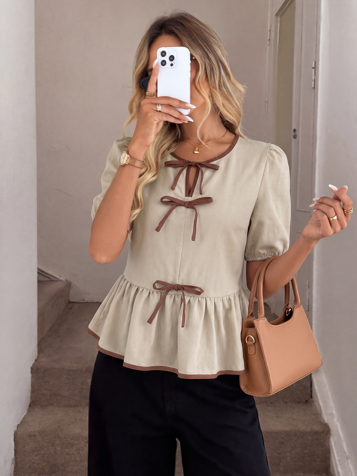 Mirror selfie in beige bow tie-front puff sleeve peplum top