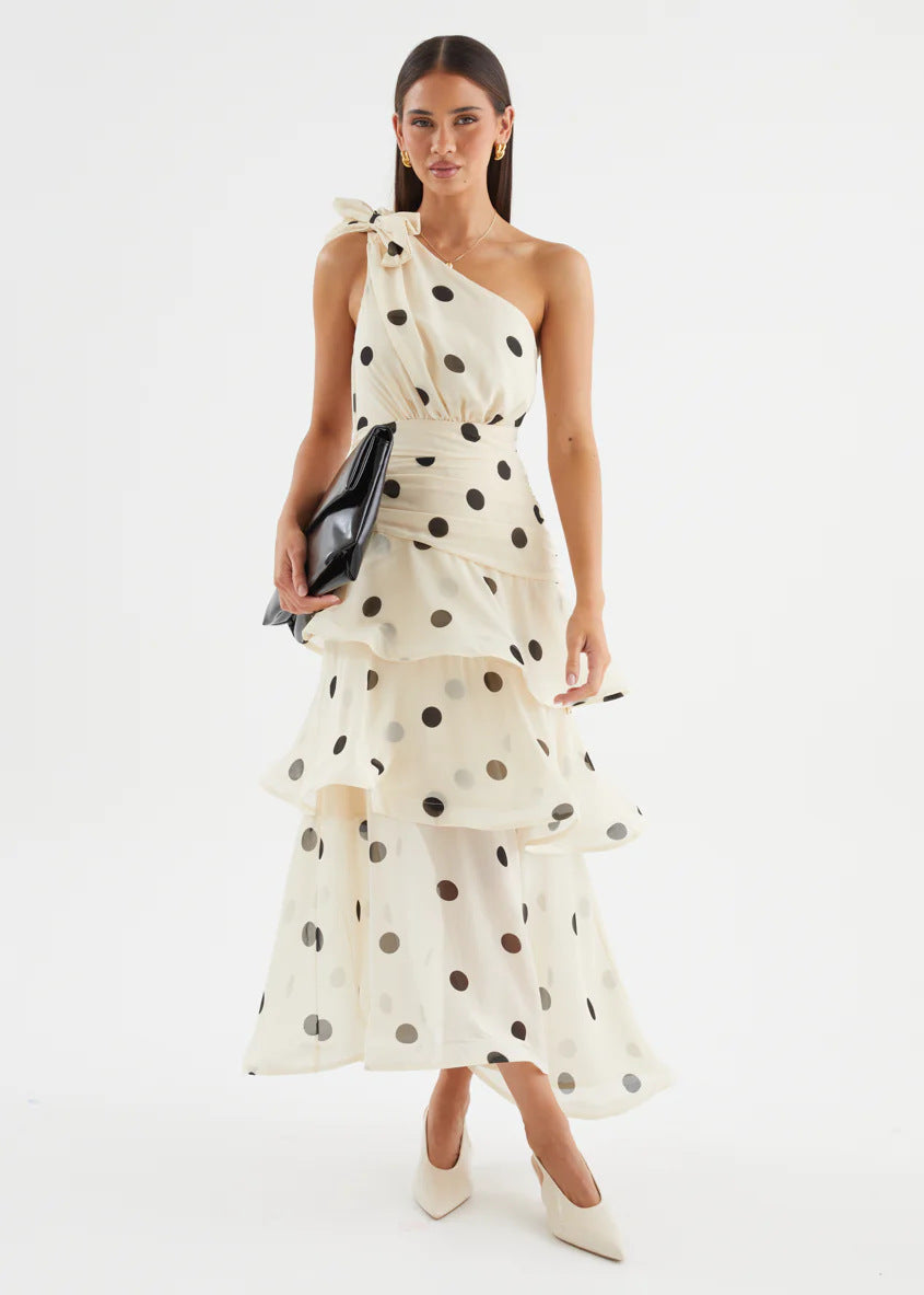 White Polka Dot One-Shoulder Midi Dress – full-length front view with black clutch