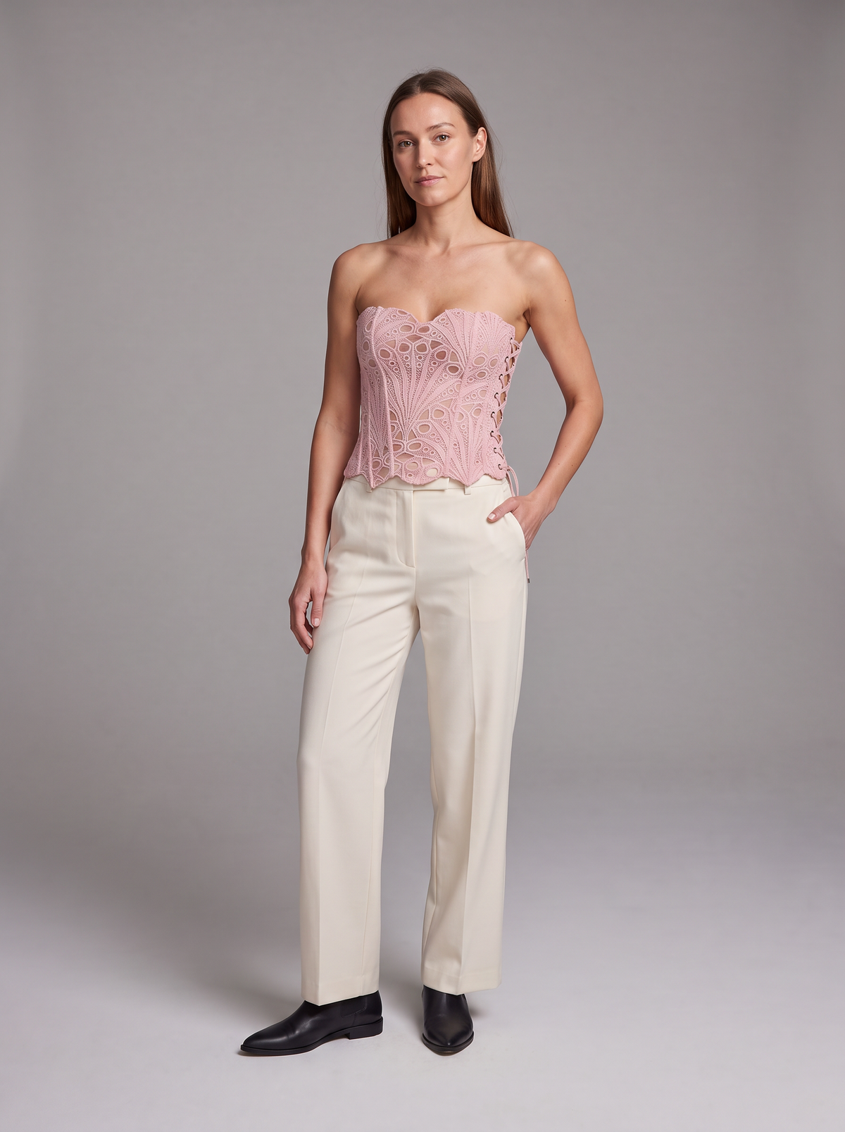 Pink Lace Corset Top – front view styled with cream trousers