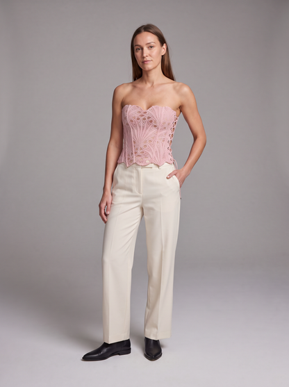 Pink Lace Corset Top – front view styled with cream trousers