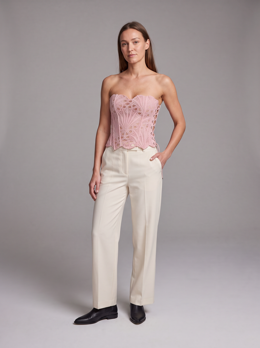 Pink Lace Corset Top – front view styled with cream trousers