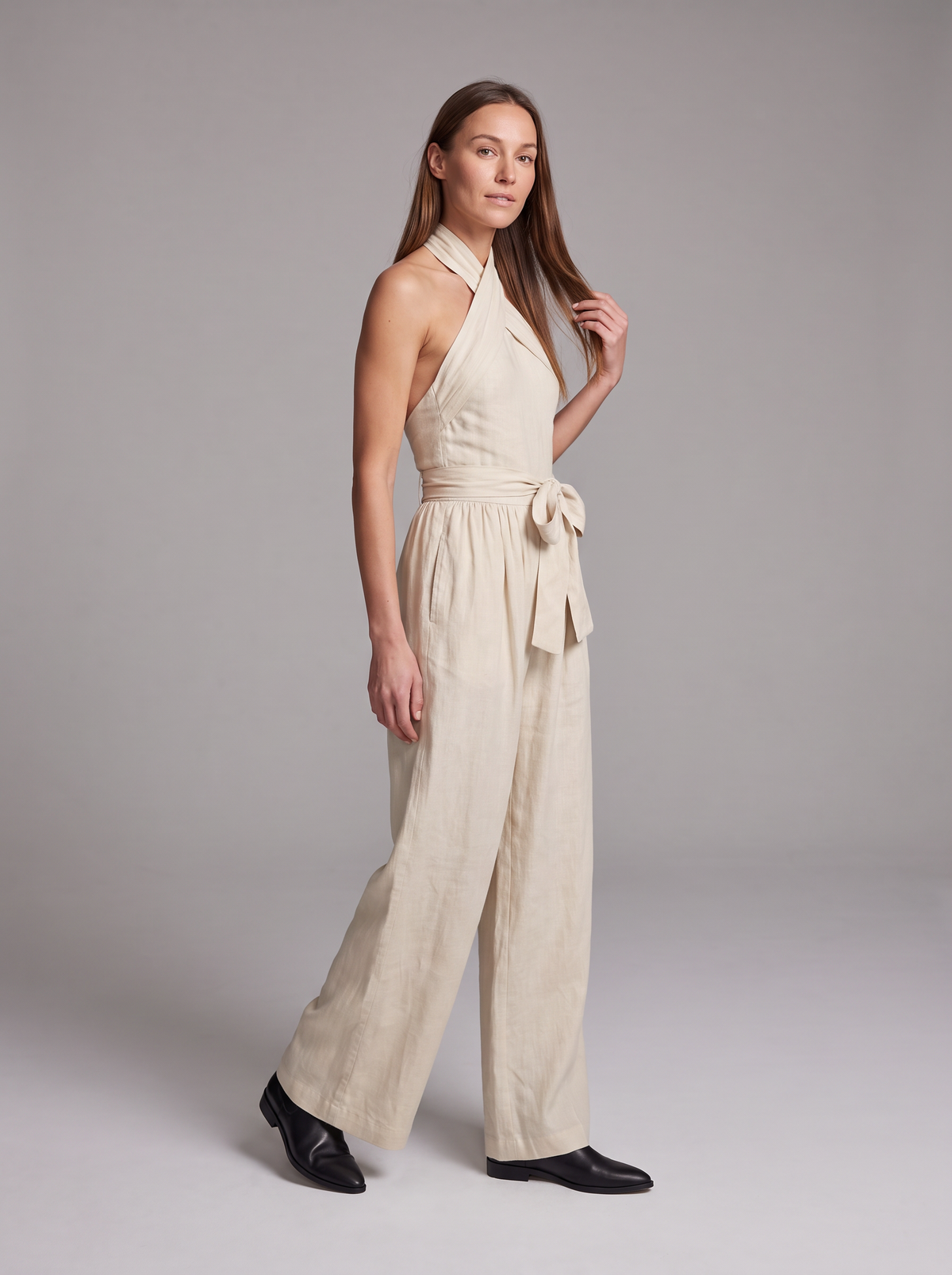 Cross Halter Wide-Leg Jumpsuit in White – full-length three-quarter view