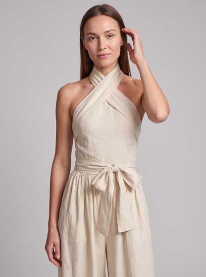 Cross Halter Wide-Leg Jumpsuit in White – close-up of cross-halter neckline and tie waist