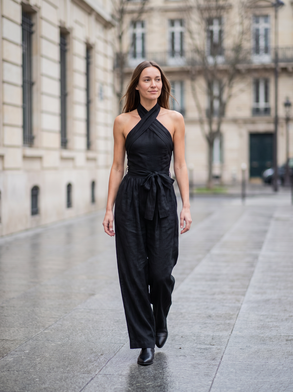 Cross Halter Wide-Leg Jumpsuit in Black – lifestyle full-length view on a street