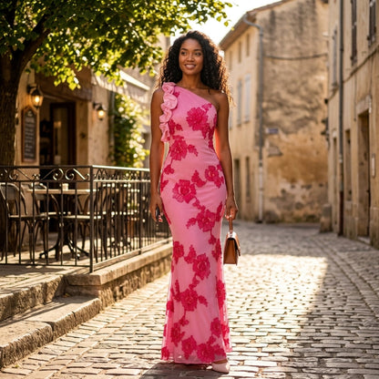Pink Floral Embroidered One-Shoulder Maxi Dress – lifestyle shot on a cobbled street