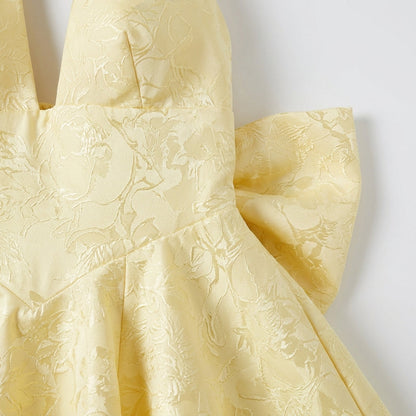Jacquard Halter Skater Mini Dress with Bow Back in Yellow – close-up detail of bodice and bow
