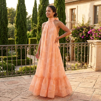 Orange Print Halter Maxi Dress – lifestyle view on a terrace