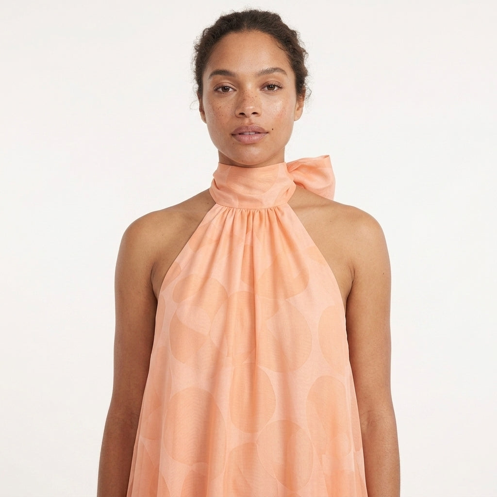 Orange Print Halter Maxi Dress – close-up of the halter neckline with bow