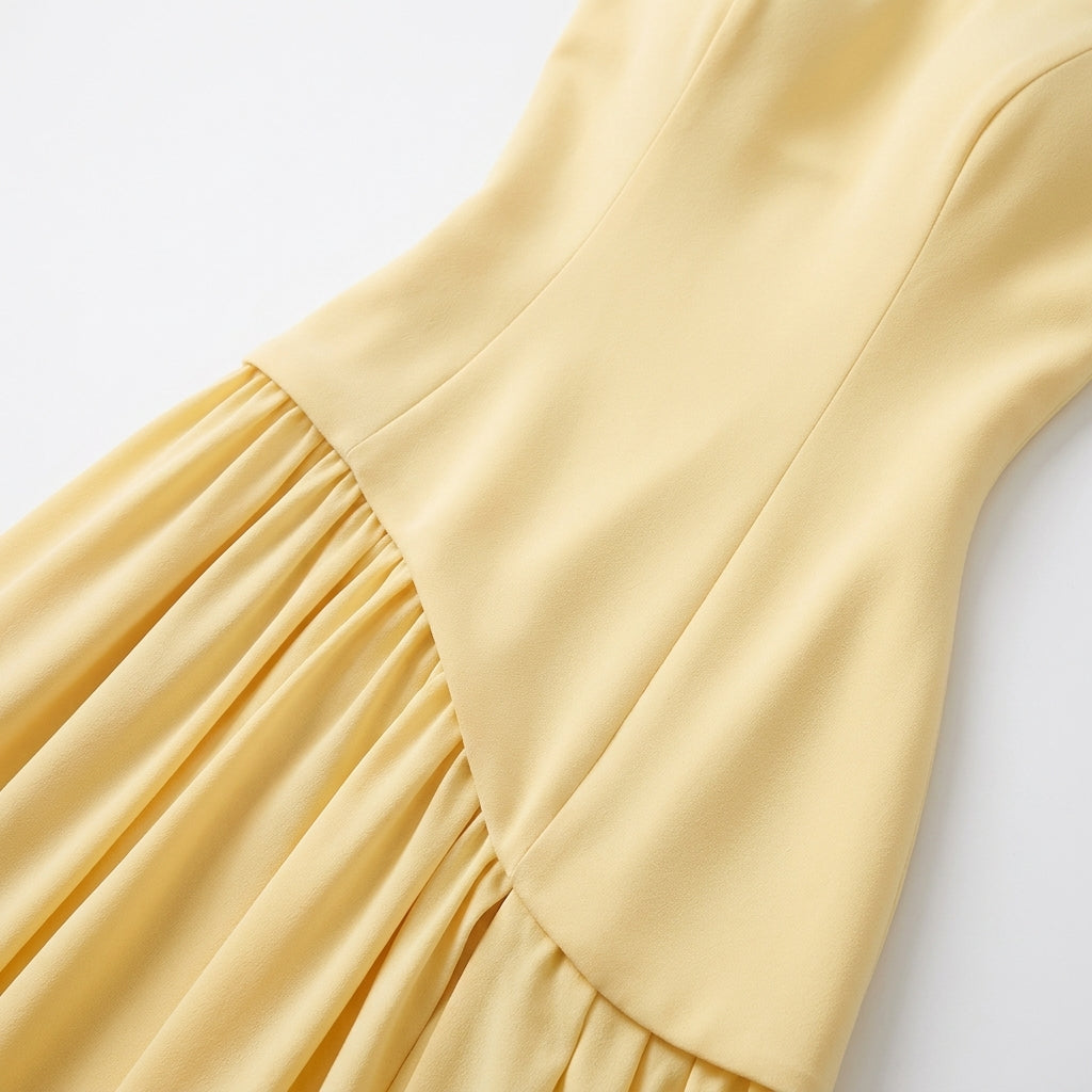Strapless Pleated Maxi Dress with Thigh Split in Yellow – close-up of asymmetric waist