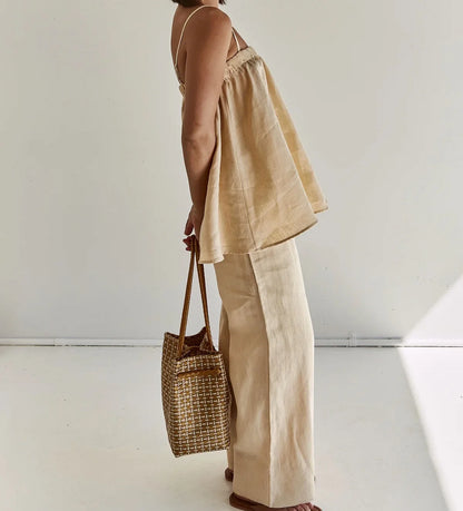 Side view of beige cotton cami and pants with tote bag