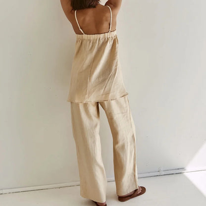 Back view of beige trapeze cami with thin straps and wide leg pants