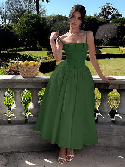 Green Corset Square Neck Midi Dress – lifestyle shot in a garden