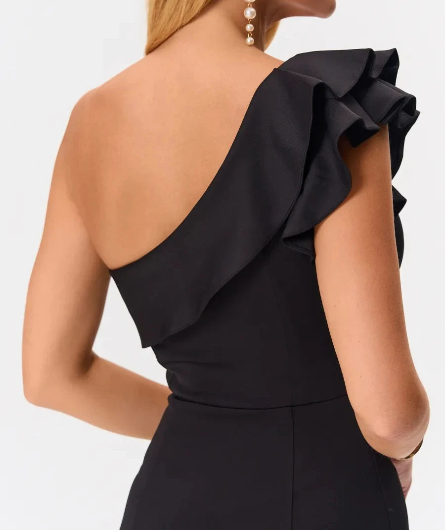 Back detail of ruffle shoulder on black one-shoulder dress