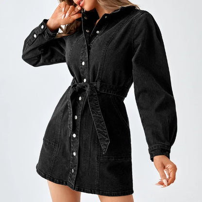 Black denim shirt dress with collar and snap buttons, model touching collar