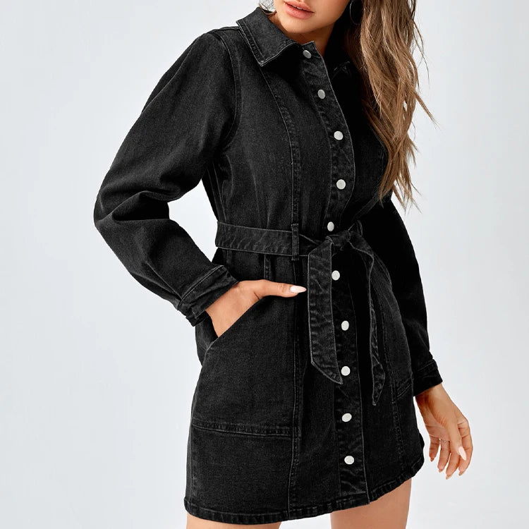Three-quarter view of black denim shirt dress with tie belt and long sleeves