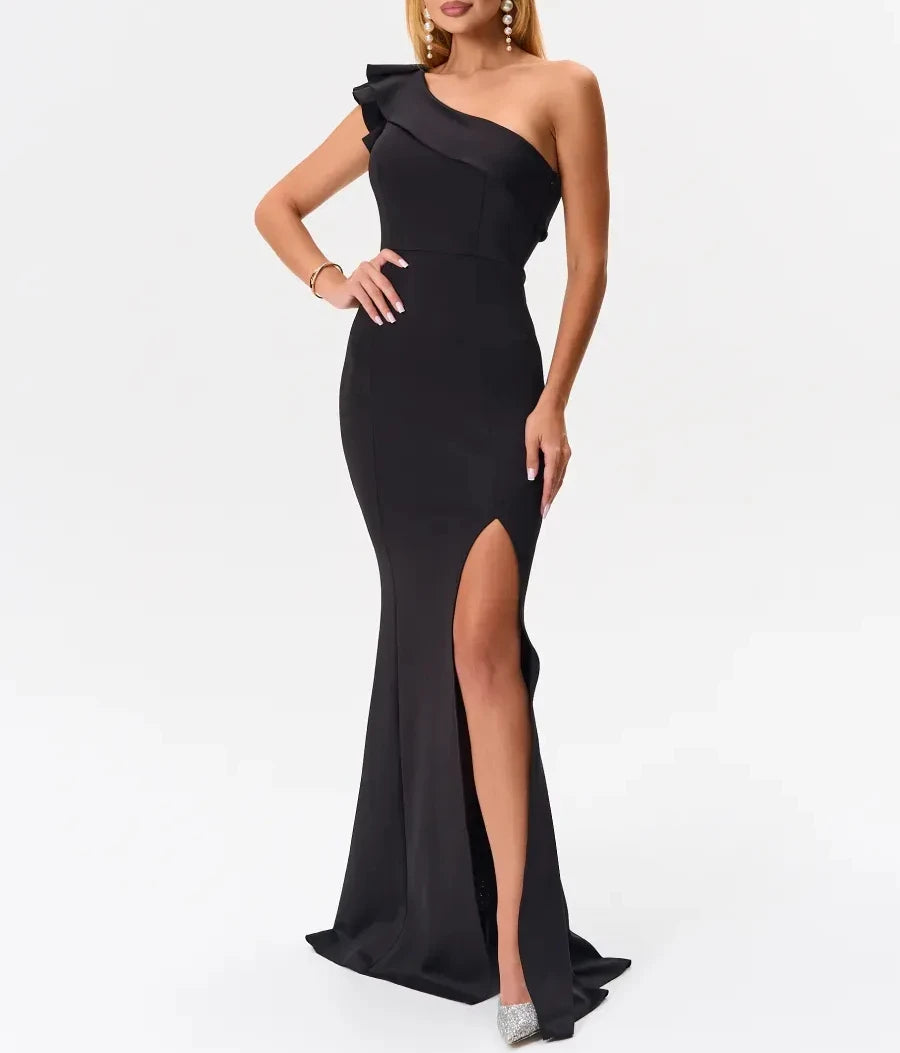 Front view of black one-shoulder ruffle mermaid maxi dress with high slit