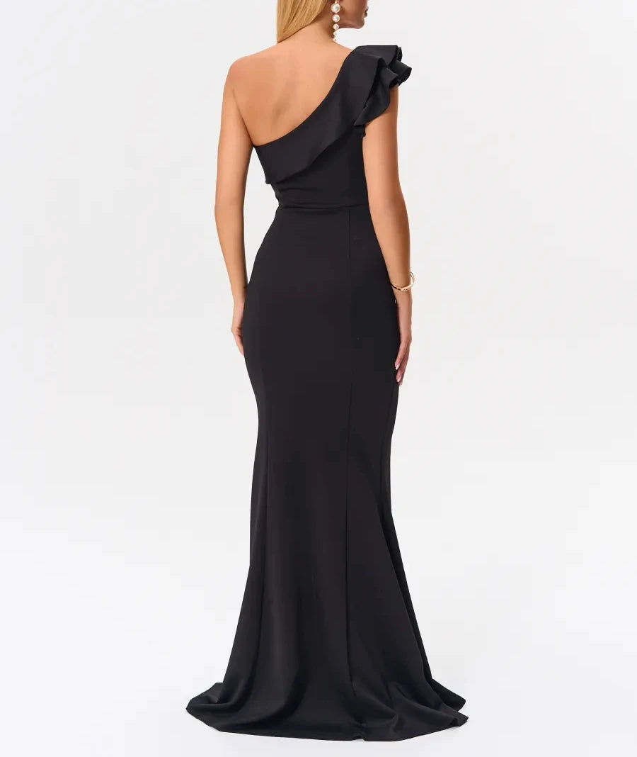 Back view of black one-shoulder mermaid dress with flared hem