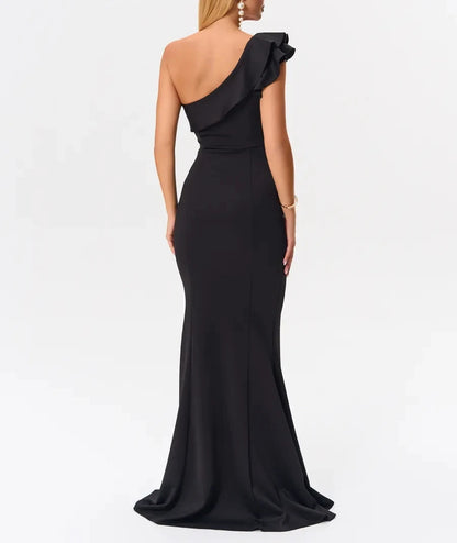 Back view of black one-shoulder mermaid dress with flared hem