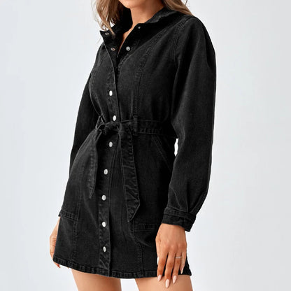 Front view of black-wash denim mini shirt dress with tied belt