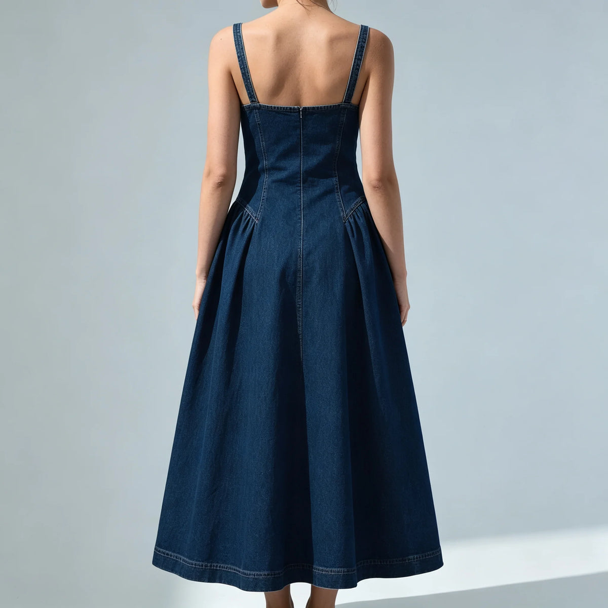 Back view of blue denim midi dress with A-line skirt