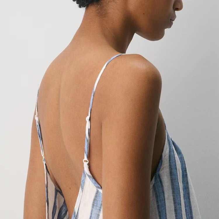 Back view close-up of fine adjustable straps and low back on striped dress