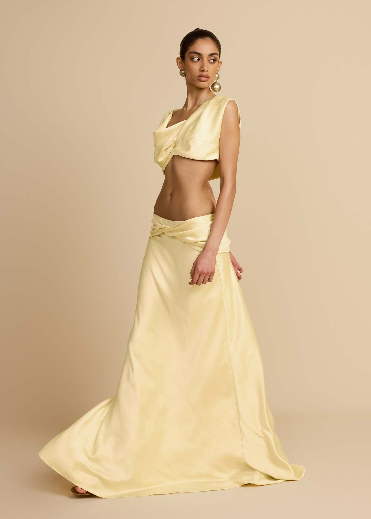 Yellow Twist Crop Top & Maxi Skirt Set – three-quarter view showing skirt train