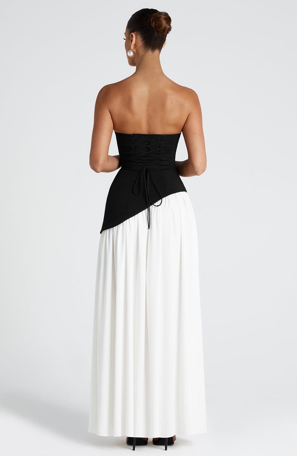 Strapless Pleated Maxi Dress with Thigh Split in Black & White – back view, black bodice with white skirt