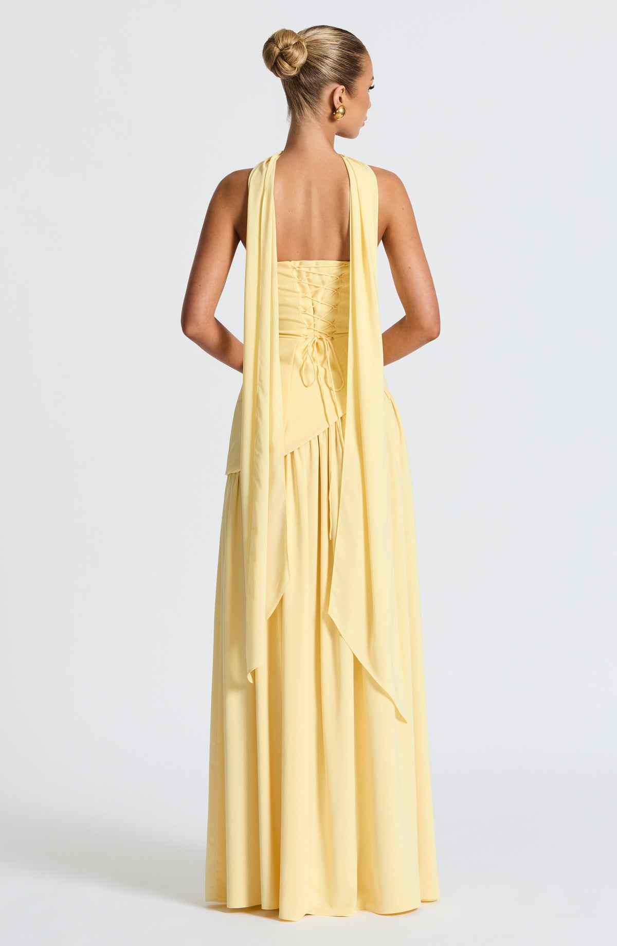 Strapless Pleated Maxi Dress with Thigh Split in Yellow – back view showing lace-up back