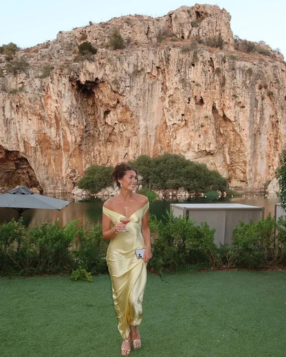 Yellow Off-Shoulder Draped Maxi Dress – lifestyle shot by a lake