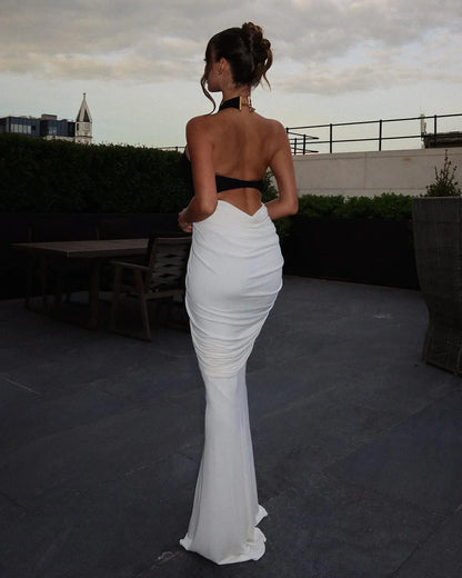 Black and White Backless Maxi Dress – lifestyle back view on a terrace