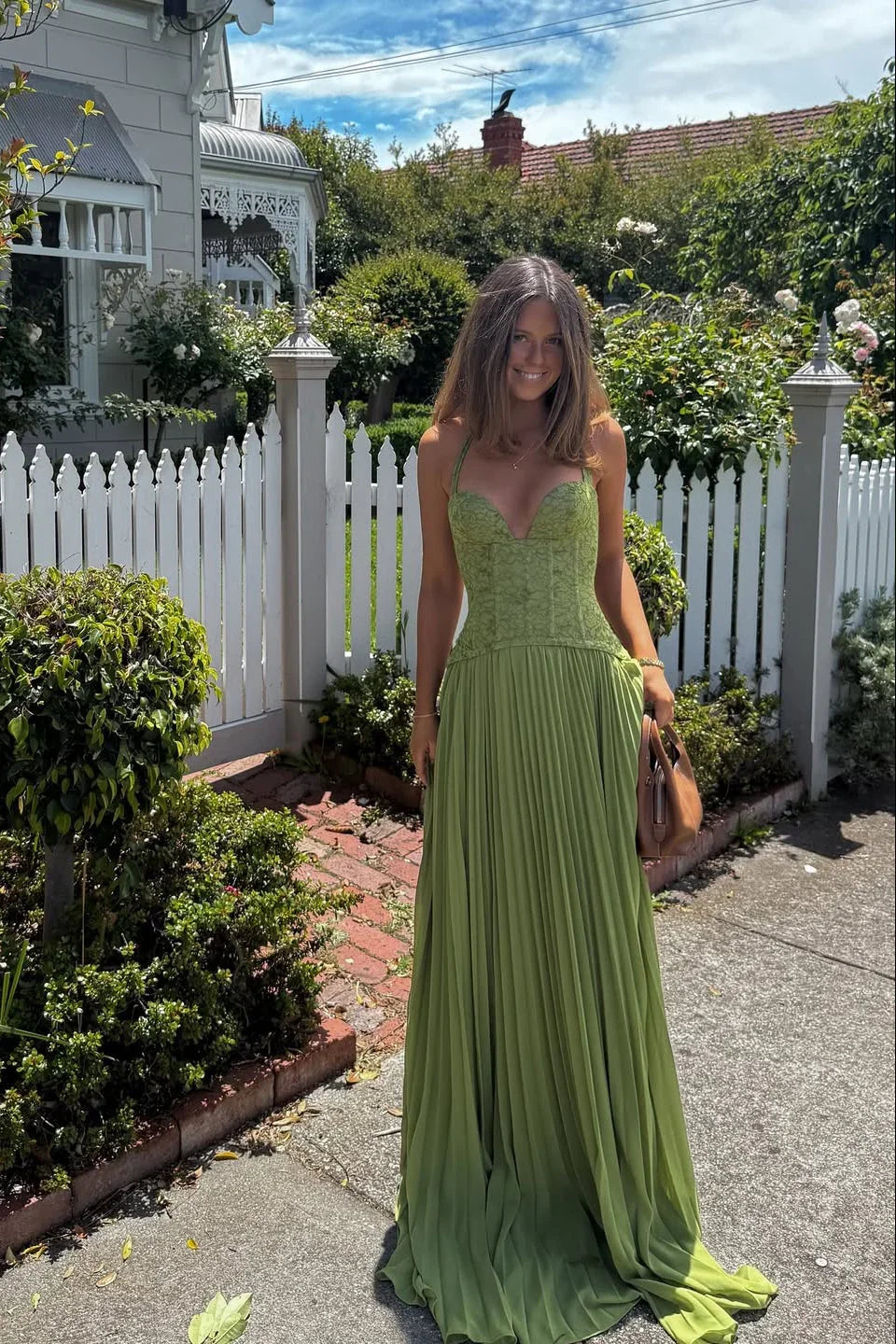 Green Corset Pleated Maxi Dress – lifestyle full-length front view outdoors