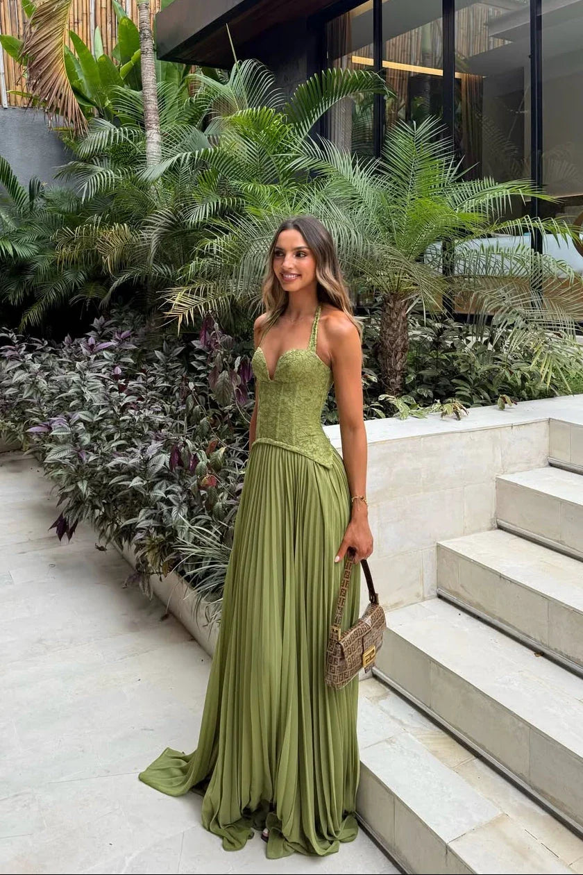 Green Corset Pleated Maxi Dress – lifestyle full-length view on garden steps